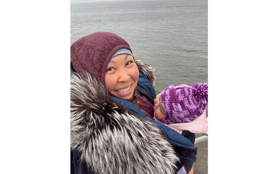 Kristin Paniptchuk holds her daughter, Kinley, in Shaktoolik, Alaska, on May 23, 2023. The Alaska Air National Guard rescued Paniptchuk in the Inupiat village of Shaktoolik, on Dec. 29, 2022, when an air ambulance couldn’t land in bad weather.