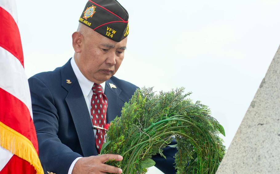 Alex Flores, commander of VFW Department of Pacific Areas, lays a Veterans Day wreath at an Army memorial on Camp Humphreys, South Korea, Nov. 11, 2023. 