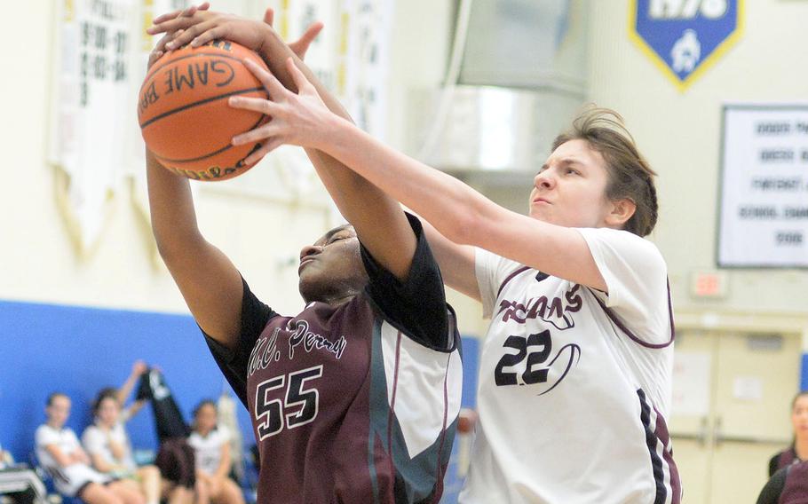 Perry's Kaiden Bradley and Zama's Anna Olson tangle for the ball. The Trojans rallied for a 26-18 win.