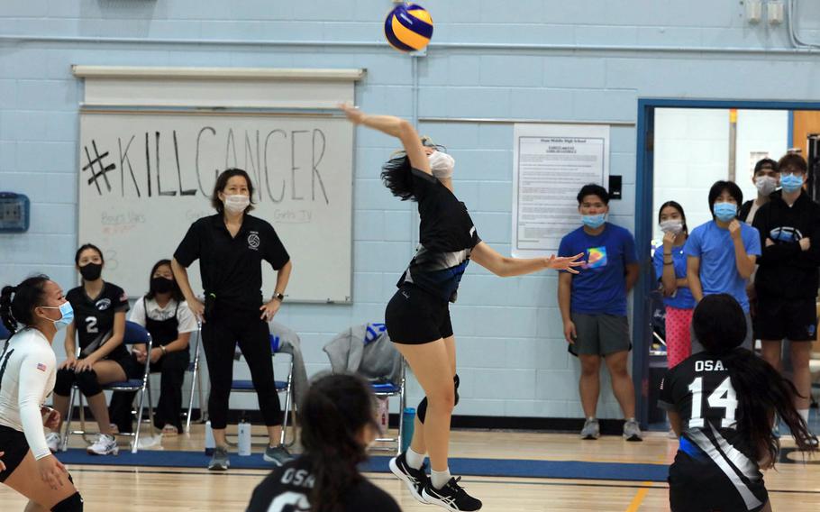 Osan's Shanaya Ungos goes up to spike against Taejon Christian during Saturday's Korea girls volleyball match. The Cougars won in four sets.