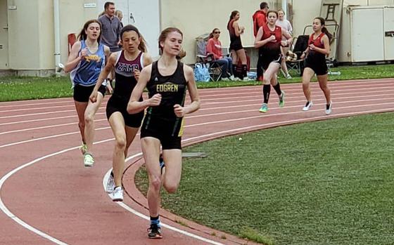 Reigning Far East cross country champion Morgan Erler of Robert D. Edgren leads the pack in the girls 800, with Zama's Liliana Fennessey and 2019 Far East cross country champion Aiko Galvin of Yokota in trail.