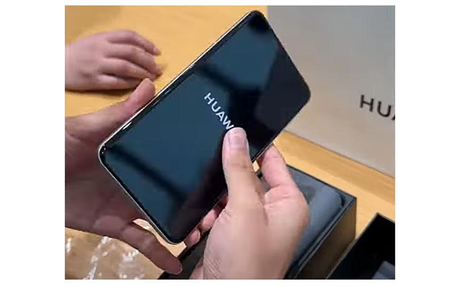 A video screen grab shows a Huawei Mate 60 Pro being unpackaged.