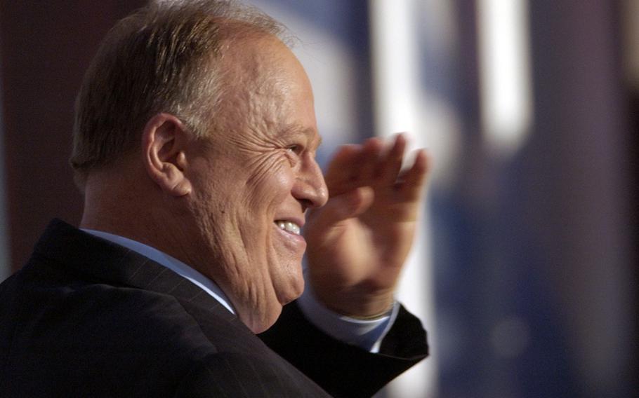 Former Georgia Sen. Max Cleland salutes delegates before introducing Sen. John Kerry at the Democratic National Convention Thursday, July 29, 2004 at the Fleet Center in Boston. Cleland died on Tuesday, Nov. 9, 2021. He was 79.