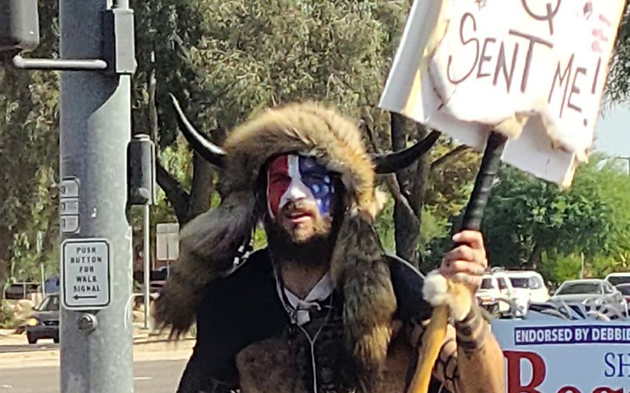 Jacob Anthony Chansley, also known as Jake Angeli and the “QAnon Shaman,” takes part in a demonstration in Peoria, Ariz., Oct. 15, 2020.