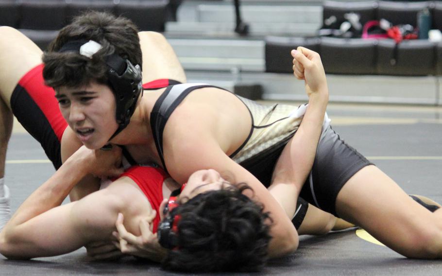 Humphreys' Joseph Fernald pins Seoul Foreign's Gabriel Surette in 1 minute, 25 seconds at 148 pounds during Wednesday's Korea wrestling dual meet. The host Blackhawks routed the Guardians 57-4.