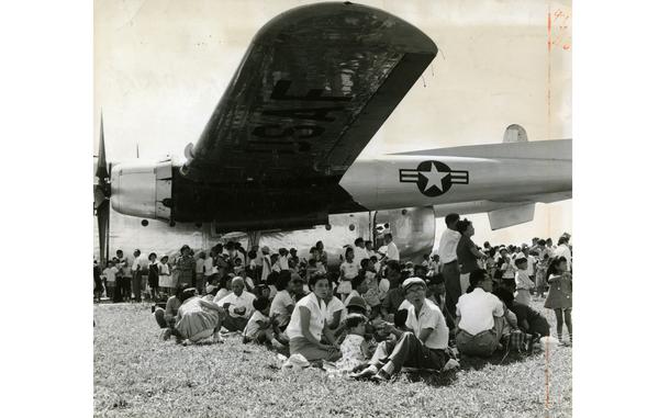 Hed: Throwing some shade, 1959

Kukuoaka, Japan, September 1959: Visitors try to find some shade under the wing of an aircraft during the Fukuoka Airport Festival held in the last days of September 1959. The annual five-day festival, now in its third year, hosted some 40,000 visitors who enjoyed jet flyovers and a display of U.S. and Japanese aircraft.

Looking for Stars and Stripes’ coverage of overseas military life through the decades? Subscribe to Stars and Stripes’ historic newspaper archive! We have digitized our 1948-1999 European and Pacific editions, as well as several of our WWII editions and made them available online through https://starsandstripes.newspaperarchive.com/

META TAGS: Kyushu Island; Itazuke Airbase; festival; Japanese-American relations; Japanese culture; American culture; U.S. Air Force; flightshow