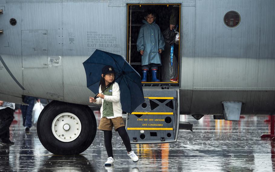 Children wrap up a tour of a KC-130J Super Hercules on Friendship Day at Marine Corps Air Station Iwakuni, Japan, Saturday, April 15, 2023.