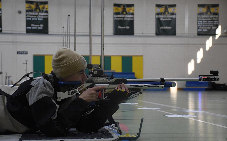 SHAPE's Roman Ciliberti takes aim in preparation for a shot during the prone part of the marksmanship meet Saturday, Dec. 100, 2022, at RAF Alconbury, England. Shooters are given 10 minutes to shoot 10 shots while in the prone firing position.