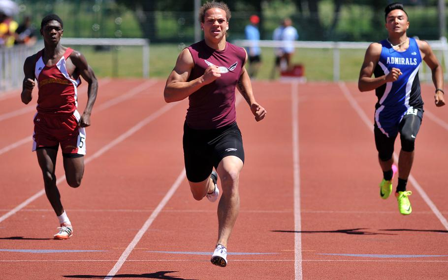 Vilseck's Zavier Scott sprints to the finish line on his way to winning the 200-meter dash at the DODEA-Europe track and field finals in Kaiserslautern, Germany, May 27, 2017. Scott signed an NFL contract with the Indianapolis Colts as an undrafted free agent. At left is Baumholder's Nathaniel Horton, at right Rota's Jake Anderson.