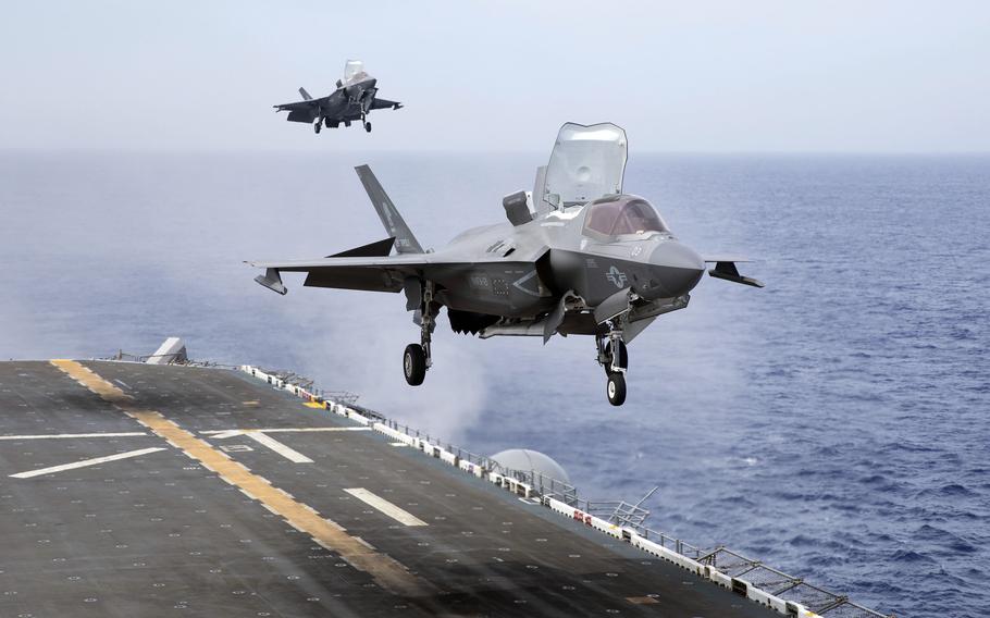 Marine Corps F-35B Lightning IIs from Marine Corps Air Station Iwakuni, Japan, approach the amphibious assault ship USS Tripoli, June 11, 2022. 