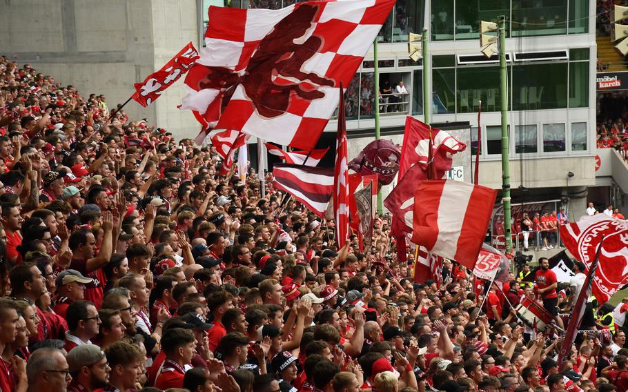 Supporters wave flags and cheer during an FC Kaiserslautern soccer game at Fritz Walter Stadium, Sunday, Aug. 28, 2022.