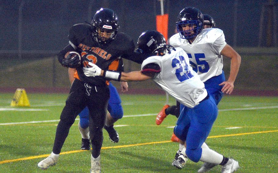 Sentinel running back Jeremy White shrugs off a tackle attempt by Brigand Rio Rogers during a Sept. 29, 2023, game at Spangdahlem High School in Spangdahlem, Germany.