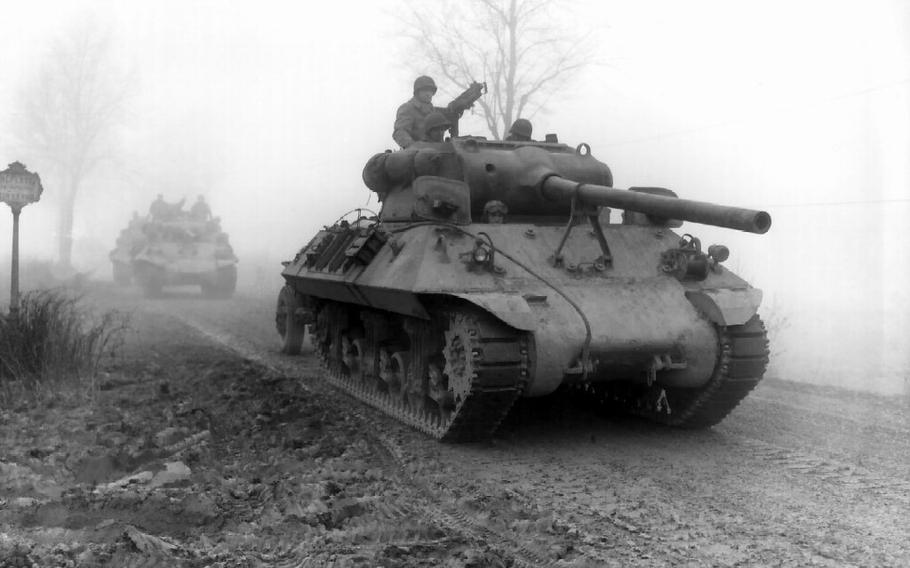 American M36 tank destroyers move forward to stem German spearhead near Werbomont, Belgium, Dec. 20, 1944.