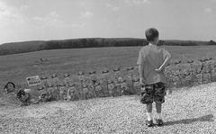 A child looks at angel figures, Aug. 4, 2002,  placed at the edge of the field near Shanksville, Pa. where United Flight 93 crashed on Sept. 11, 2001. Forty-four people died, including the hijackers. 