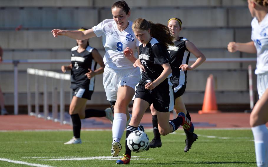 Wiesbaden’s Hannah Buchheit tries to get her foot between Stuttgart’s Haley Wells and the bal, in a Division I girls semifinal at the DODEA-Europe soccer championships in Kaiserslautern, Germany, Wednesday, May 18, 2022. Wells scored a goal in the Panthers’ 4-2 win and will face Ramstein in the championship game.