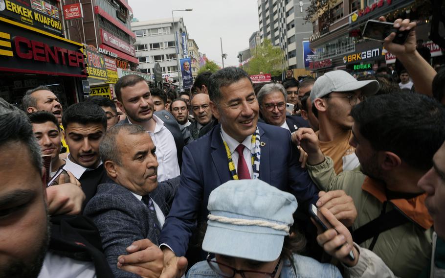 Sinan Ogan, center, the nationalist presidential candidate, is surrounded by supporters during a city tour, in Ankara, Turkey, May 4, 2023. 