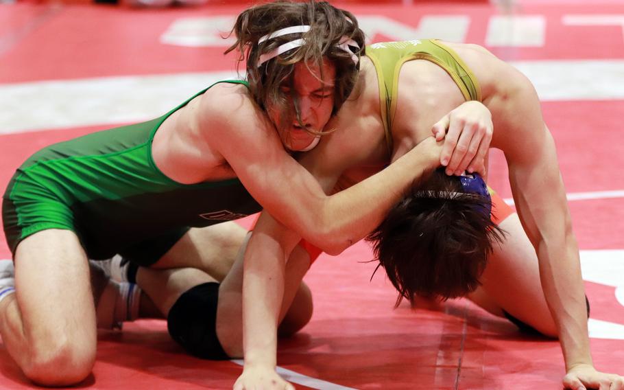 Kubasaki's Max Lundberg gets set to score a pin over St. Mary's Taiyo Mitsuoka at 148 pounds.