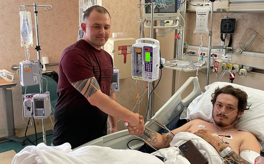 Army Sgt. 1st Class Corey Engard visits Colton Rogers, 22, at Anderson Regional Medical Center in Meridian, Miss., on Nov. 18, 2023.