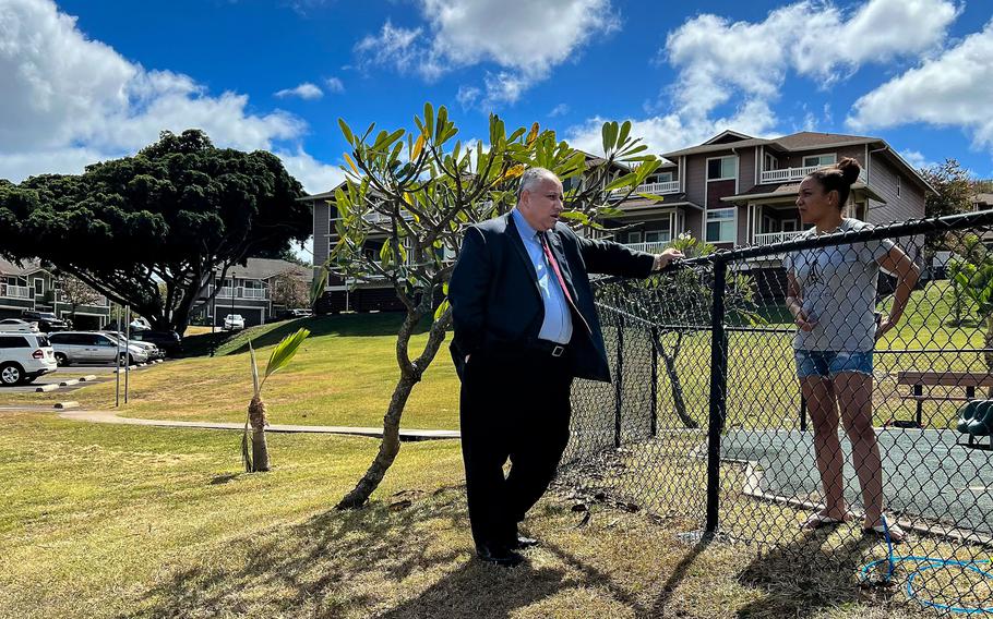 Secretary of the Navy Carlos Del Toro on Feb. 26, 2022, speaks with an airman living in the Red Hill neighborhood about the Navy’s ongoing work at restoring safe drinking water to areas affected by petroleum contamination from the Red Hill underground fuel storage facility.