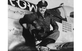 Captain Clarence E. Jr. “Bud” Anderson, ace of the 357th Fighter Group, sits on the wing of his P-51 Mustang, nicknamed “Old Crow.”