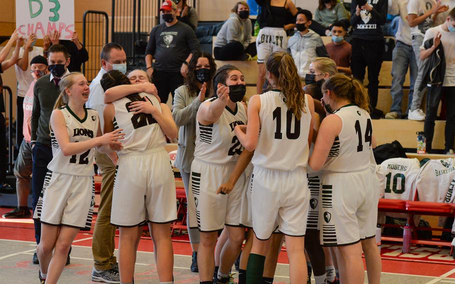 The AFNORTH Lions celebrate the first group hug after the final buzzer signaled the end of the DODEA-Europe Division III girls basketball title game in Kaiserslautern, Germany, on Saturday, Feb. 26, 2022.