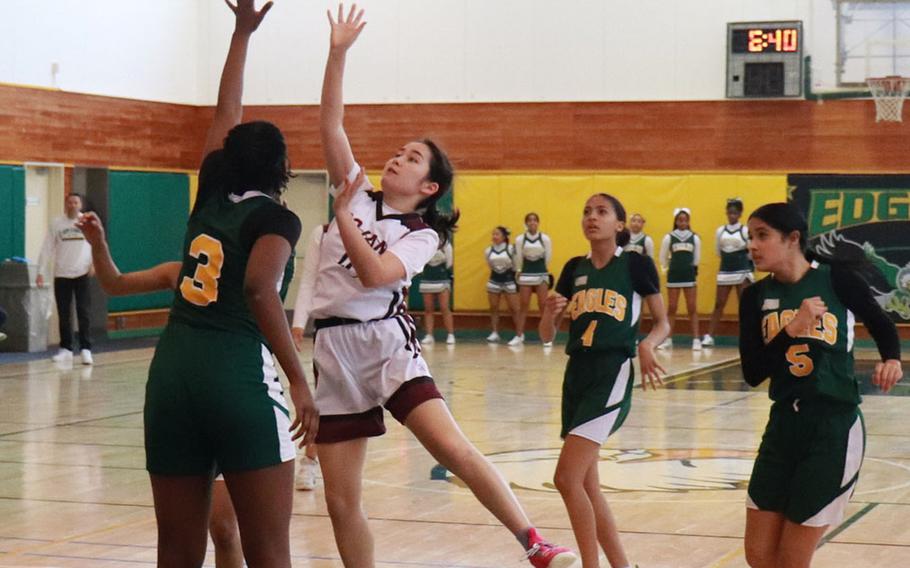 Zama's Lindsey So puts up a shot while Robert D. Edgren's Aniah Cain tries for a block.