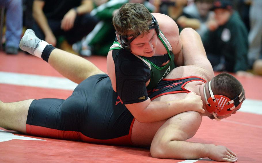 Kubasaki heavyweight Anthony Finegan gains control of Nile C. Kinnick's Bobby Crisafulli. Finegan won by 8-0 decision in the final bout, dethroning the defending champion.