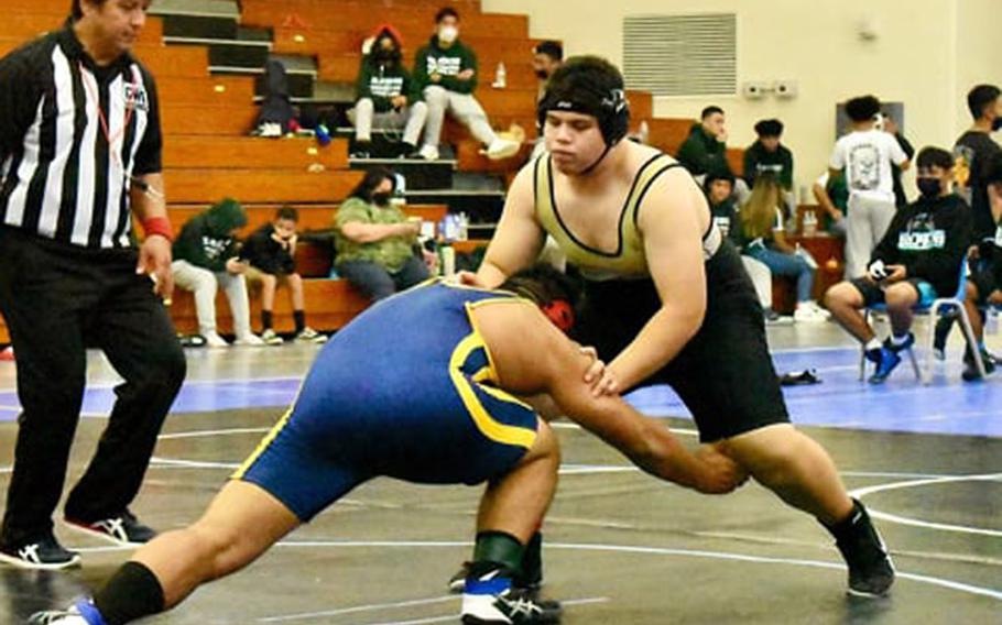 Guam High 285-pounder Joaquin Gogue moves in quickly to take down Southern's Adyn Wright during Saturday's Guam wrestling dual meet. Gogue pinned Wright in 23 seconds and the Dolphins won the meet 39-27.