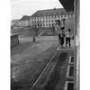 Hed: Looking out on the future, 1950

M. Sgt. William F. Garland, of Hq Co., 18th Inf., his wife, Helen, and their three daughters, Glenda Lee, 7, Billie Joe, 6, and Sandra Elizabeth, 3, stand on the balcony of their new apartment, one of the 156 newly constructed apartment units for servicemembers and their family in Aschaffenburg. The roads and landscaping in the housing project has yet to be finished.

Read the 1950 article on the then new housing area here.
https://www.stripes.com/history/2022-06-13/eucom-housing-design-1950-6329852.html

Looking for Stars and Stripes’ coverage of overseas military life through the decades? Subscribe to Stars and Stripes’ historic newspaper archive! We have digitized our 1948-1999 European and Pacific editions, as well as several of our WWII editions and made them available online through https://starsandstripes.newspaperarchive.com/


META TAGS: Europe; West Germany; military housing; military base; way of life; housing; family; children; servicemember; soldier; infantry; siblings; spouse; dependents; apartment; building; construction; street