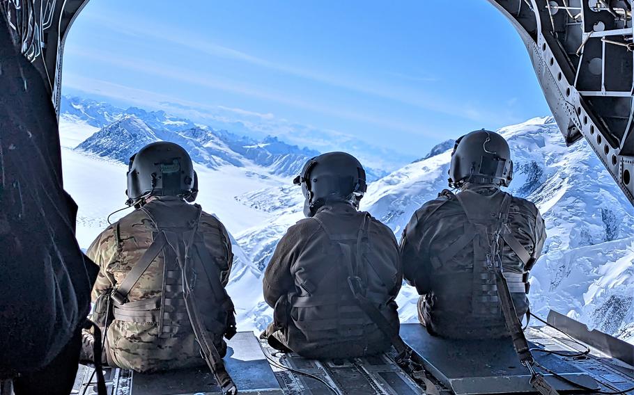 Soldiers from Bravo Company, 1st Battalion, 52nd Aviation Regiment enjoy the view on the flight back from the National Park Service’s mountaineering base camp on Kahiltna Glacier in Denali National Park and Preserve in Alaska. 