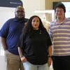 From left, Director of Exhibitions Cale Carter II, Director of Education Dr. Michelle Tovar, and archivist Jason Fung pose for a photo inside the Buffalo Soldiers National Museum on Friday, June 27, 2025, in Houston, Texas. (AP Photo/Ashley Landis)