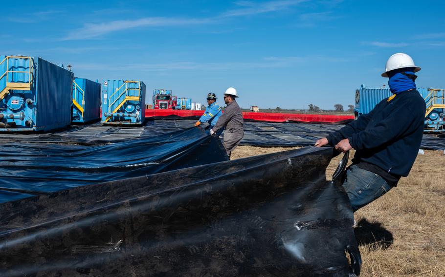 Contractors prepare an aquifer flow rate testing site as part of a pilot study civil engineering project during a per- and polyfluoroalkyl (PFAS) remedial investigation Nov. 18, 2021, at Cannon Air Force Base, N,M. 