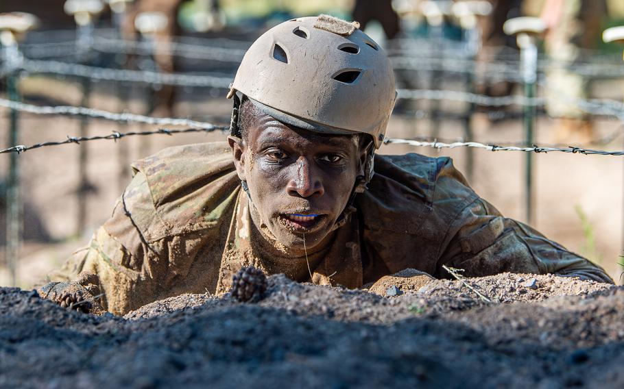 A cadet with mud covering his face