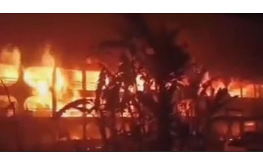 A video screen grab shows a fire devouring a packed passenger ferry in Bangladesh, killing dozens of people.