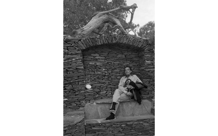 Spanish artist Salvador Dali, lounges in what is called “The Throne Room,” situated at the end of the “Milky Way” in the gardens of his home in Port Lligat, Spain. When interviewed by Stars and Stripes in 1962, the madcap surrealist had maintained and expanded his artistic retreat in the small fishing village on the Spanish Costa Brava for the past 30 years.