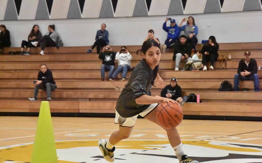 AFNORTH’s Selah Skariah quickly navigates through a cone obstacle course during the skills competition of the DODEA-Europe Girls All-Star Basketball Game in Vicenza, Italy, on Saturday, Feb. 24, 2024.