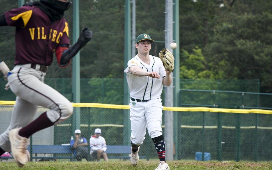 SHAPE’s Will Bush throws out Vilseck’s Carlos Alamon during a 2024 DODEA European baseball championship game on May 23, 2024, at Southside Fitness Center on Ramstein Air Base, Germany.