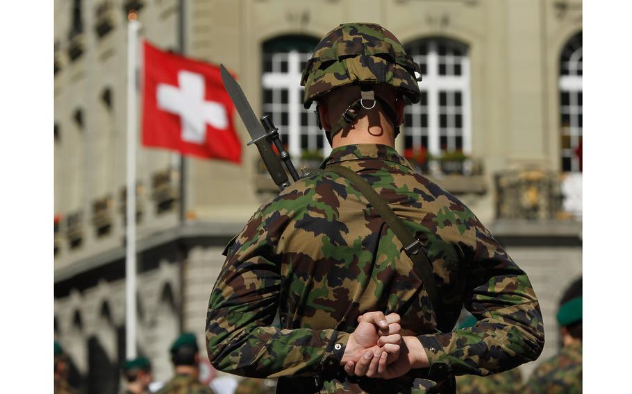 A Swiss soldier stands at attention in Bern, Switzerland in 2010. The country has long prided itself on its political neutrality. 