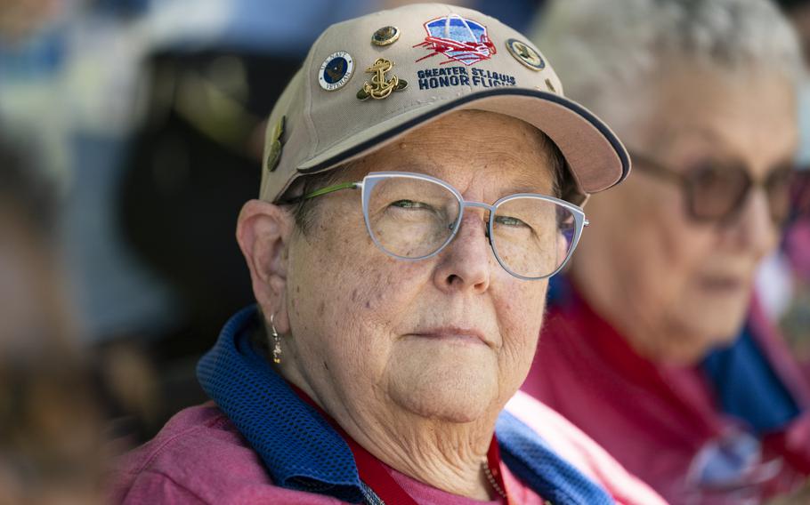 A female veteran looks straight