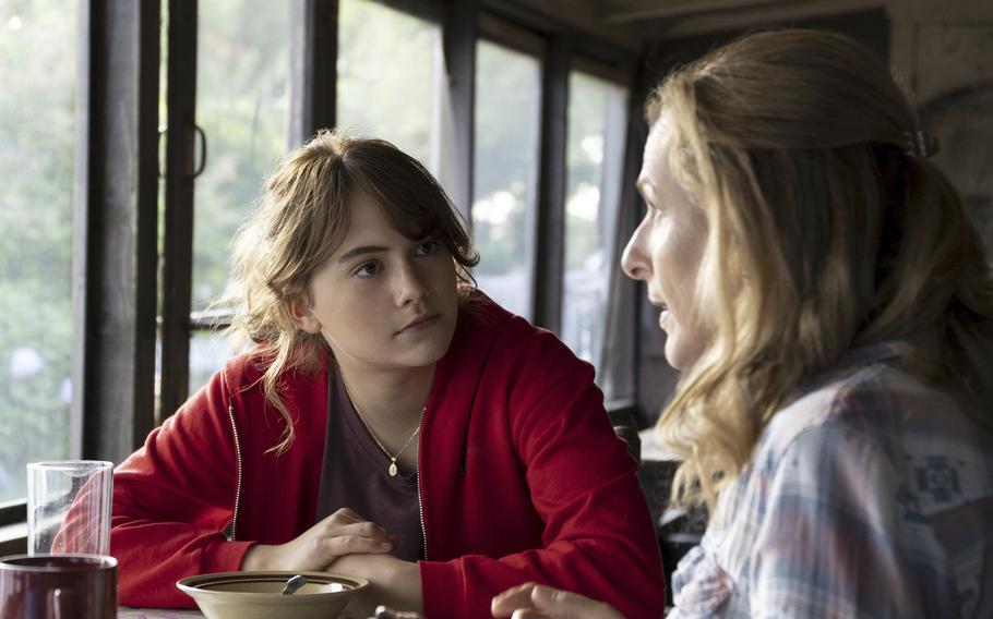 This image released by Apple TV+ shows Emilia Jones, left, and Marlee Matlin in a scene from "CODA." 