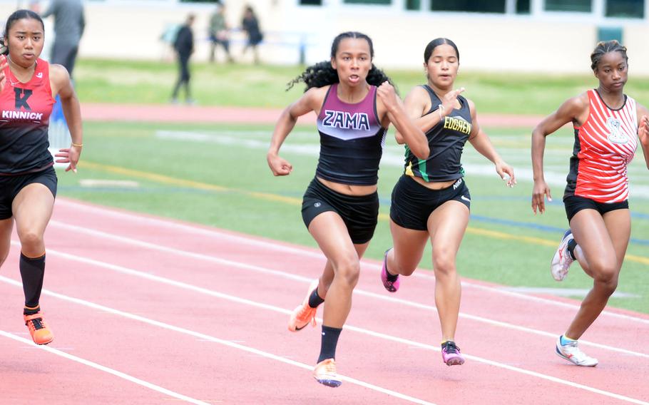 Zama sophomore Madison Anderson pulls away for the win in the 100 during Saturday’s DODEA-Japan district track finals.
