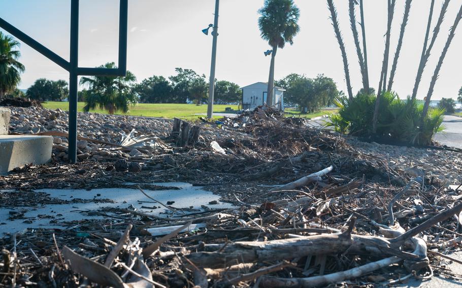 Debris from a hurricane covers an entrance of a golf complex