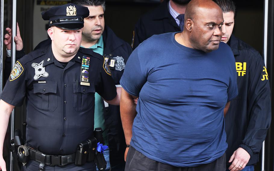 Suspect Frank James is led by police from Ninth Precinct after being arrested for his connection to the mass shooting at the 36th Street subway station on April 13, 2022, in New York City. 
