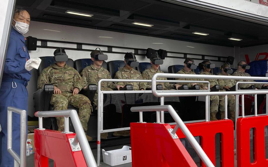 Airmen wear virtual reality goggles during the simulation of a major earthquake at Yokota Air Base, Japan, March 28, 2024.