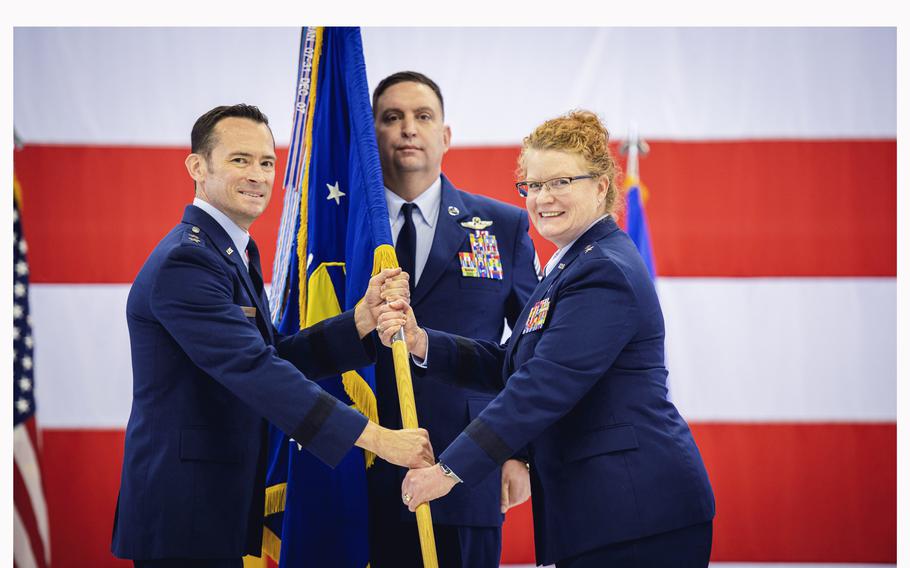 Maj. Gen. Paul Moga, commander of the 3rd Air Force, left, hands over the unit colors to Brig. Gen. Adrienne Williams, marking the beginning of her command of the 86th Airlift Wing on May 17, 2024, at Ramstein Air Base, Germany. 