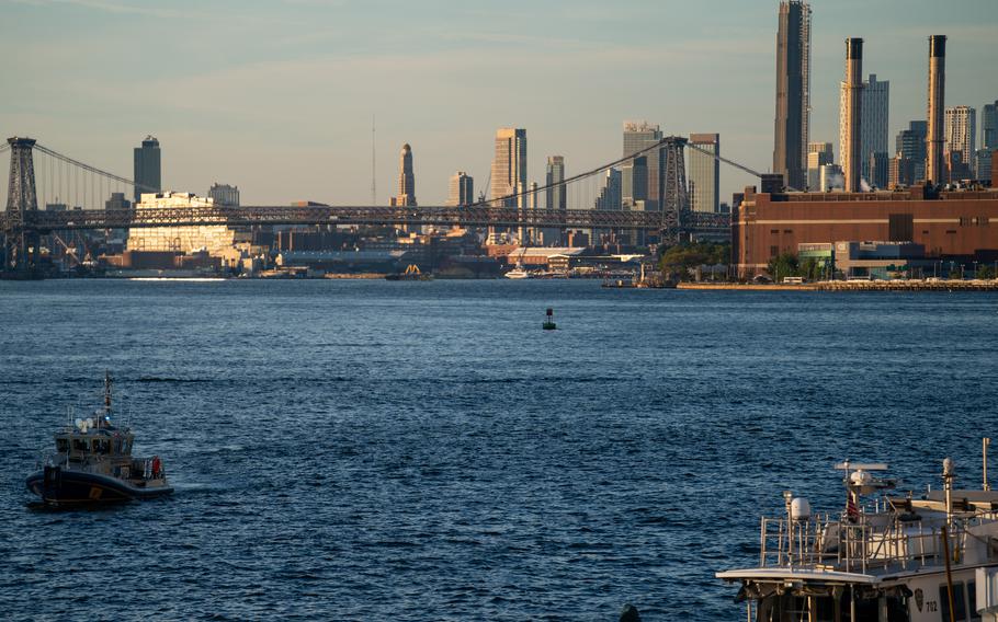 NYPD and Coast Guard boats patrol the East River outside the United Nations headquarters, Tuesday, Sept. 21, 2022, in New York.