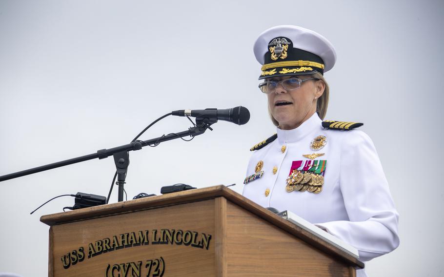 Capt. Amy N. Bauernschmidt, outgoing commanding officer of the Nimitz-class aircraft carrier USS Abraham Lincoln (CVN 72), delivers remarks during a change of command ceremony Thursday, May 18, 2023, on the flight deck.