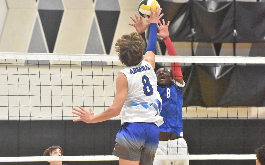 Sigonella’s Deshawn Wallace tries to block a tap from Rota’s Tyler DeMeritt during the opening day of the DODEA-Europe boys volleyball championships on Thursday, Oct. 23, 2026.