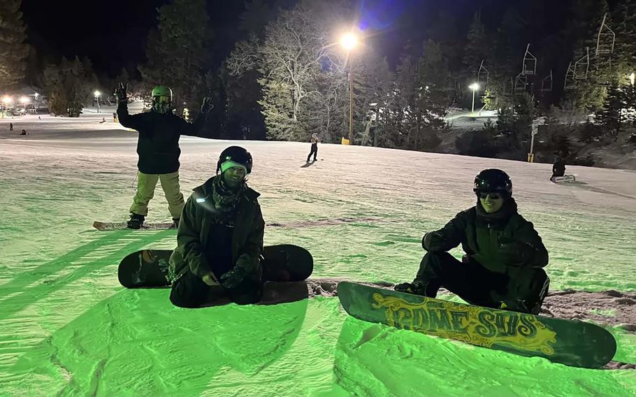 From left, Daniel Galan, Braden Walker and Lawrence Doherty take a brief rest between snowboarding runs at Mountain High in the San Gabriel Mountains. 