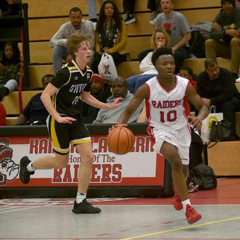 Kaiserslautern's Dom Polider looks up the court while Stuttgart's Jacob Schudel gets back on defense during Friday evening's game at Kaiserslautern High School in Kaiserslautern, Germany.